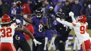 Baltimore Ravens quarterback Lamar Jackson (8) passes the ball against the Kansas City Chiefs in the AFC Championship