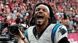 Carolina Panthers quarterback Cam Newton yells "I'm back!" after scoring a touchdown against the Arizona Cardinals in 2021