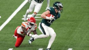 Philadelphia Eagles cornerback Cooper DeJean (33) returns a punt against Kansas City Chiefs safety Nazeeh Johnson