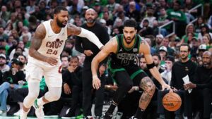 Boston Celtics forward Jayson Tatum drives the ball against Cleveland Cavaliers forward Marcus Morris Sr. in NBA playoffs