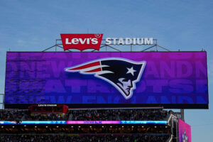 The New England Patriots logo is shown during the game