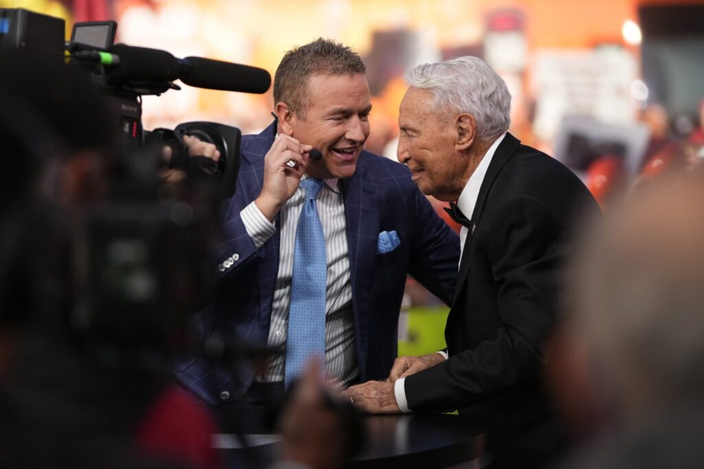 Kirk Herbstreit talks to Lee Corso on the set of ESPN College GameDay prior to the NCAA football game between the Ohio State