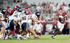 Oklahoma's Lloyd Avant (9) rushes in first half of the college football game between the University of Oklahoma Sooners and the