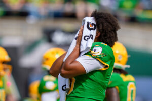 Oregon quarterback Dante Moore wipes off his face as the Oregon Ducks host the Boise State Broncos on Sept. 5, 2026, at Autzen