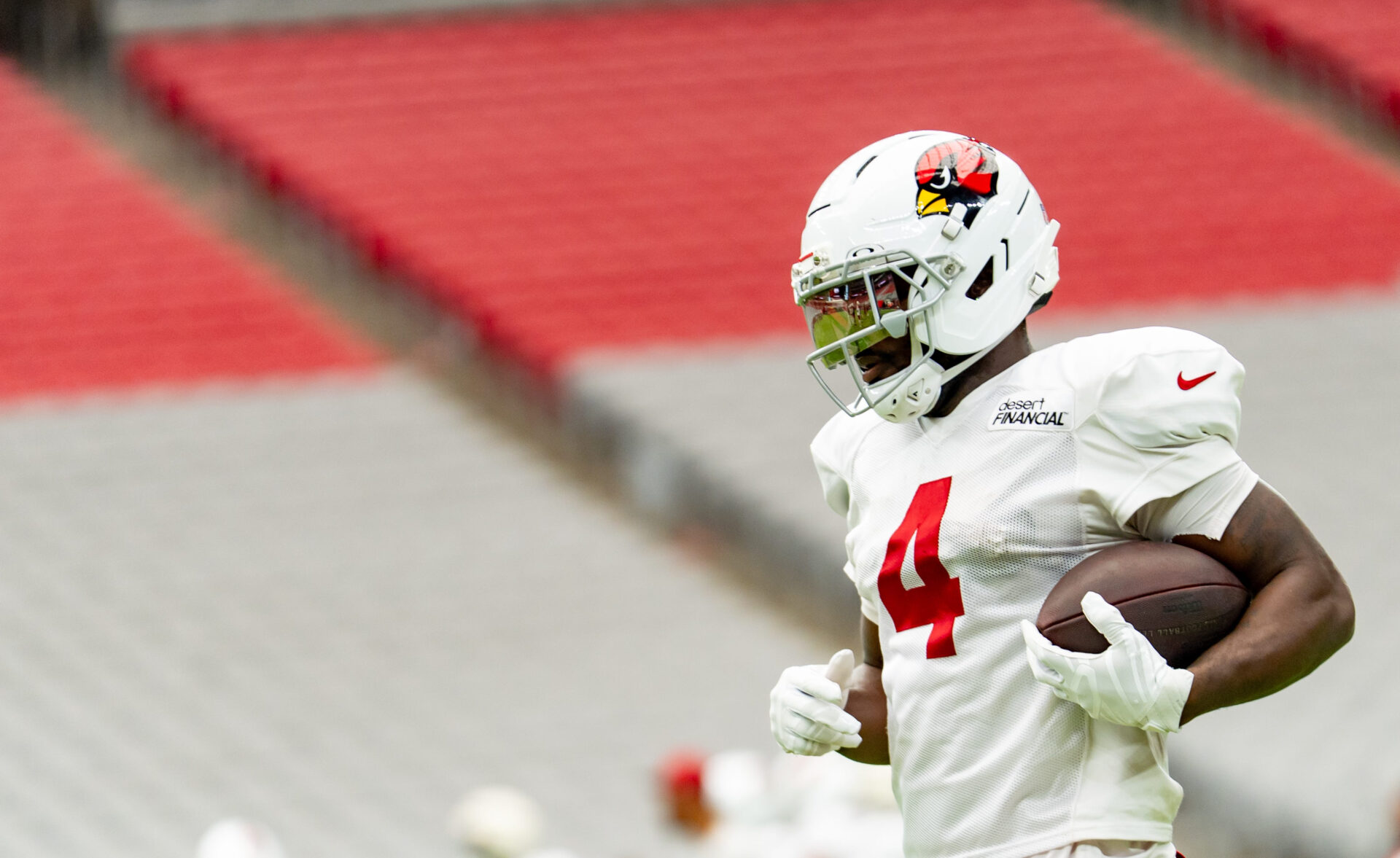 Photo: thebiglead.com Arizona Cardinals Jeremiyah Love (4) runs with the ball during training camp at State Farm Stadium in Glendale on Aug. 11