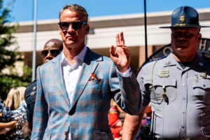 Ole Miss head coach Lane Kiffin participates in the Walk of Champions before a college football game between Ole Miss and LSU at