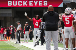 Ohio State Buckeyes wide receiver Jeremiah Smith (4) is recognized as the school's all time receiving leader during the NCAA