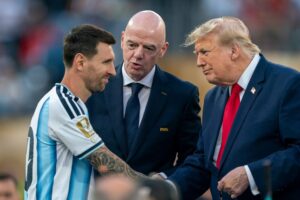 Argentina forward Lionel Messi (10) shakes hands with FIFA President Gianni Infantino and President Donald Trump following