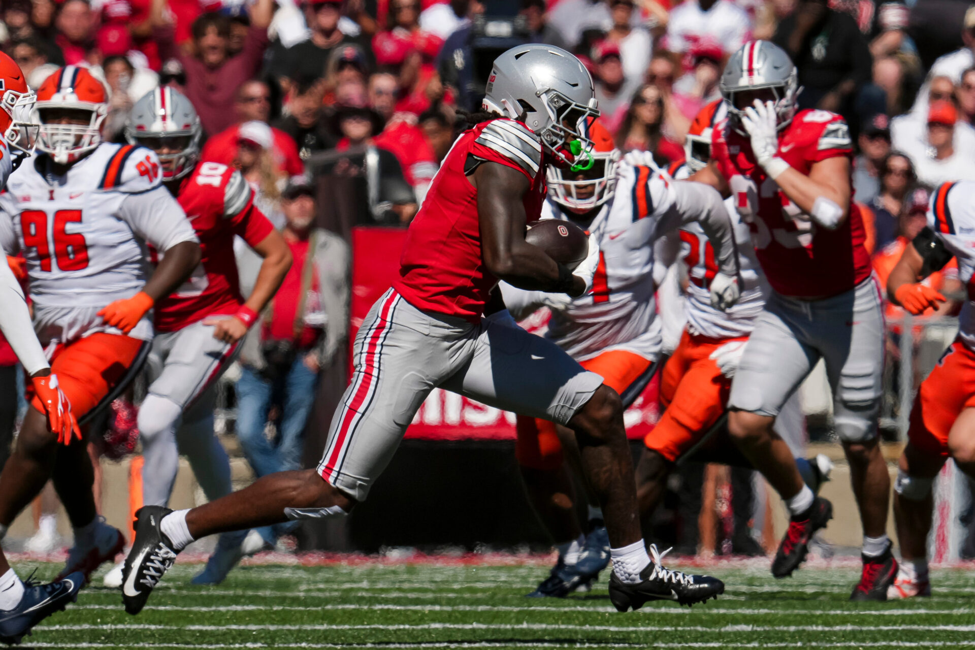 Ohio State Buckeyes wide receiver Jeremiah Smith (4) catches a pass during the NCAA football game against the Illinois Fighting