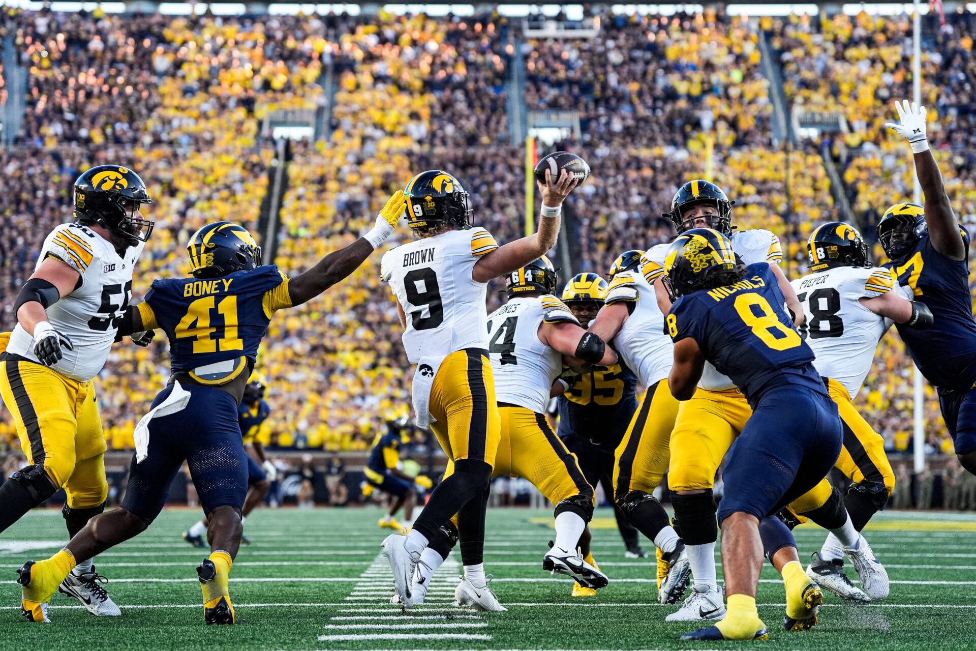 Iowa quarterback Hank Brown (9) makes a pass against Michigan defensive end Tariq Boney (41) during the second half at Michigan