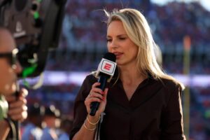 ESPN’s Laura Rutledge reports from the sideline during the second quarter of an NCAA football game, Saturday, Nov. 1, 2025, at
