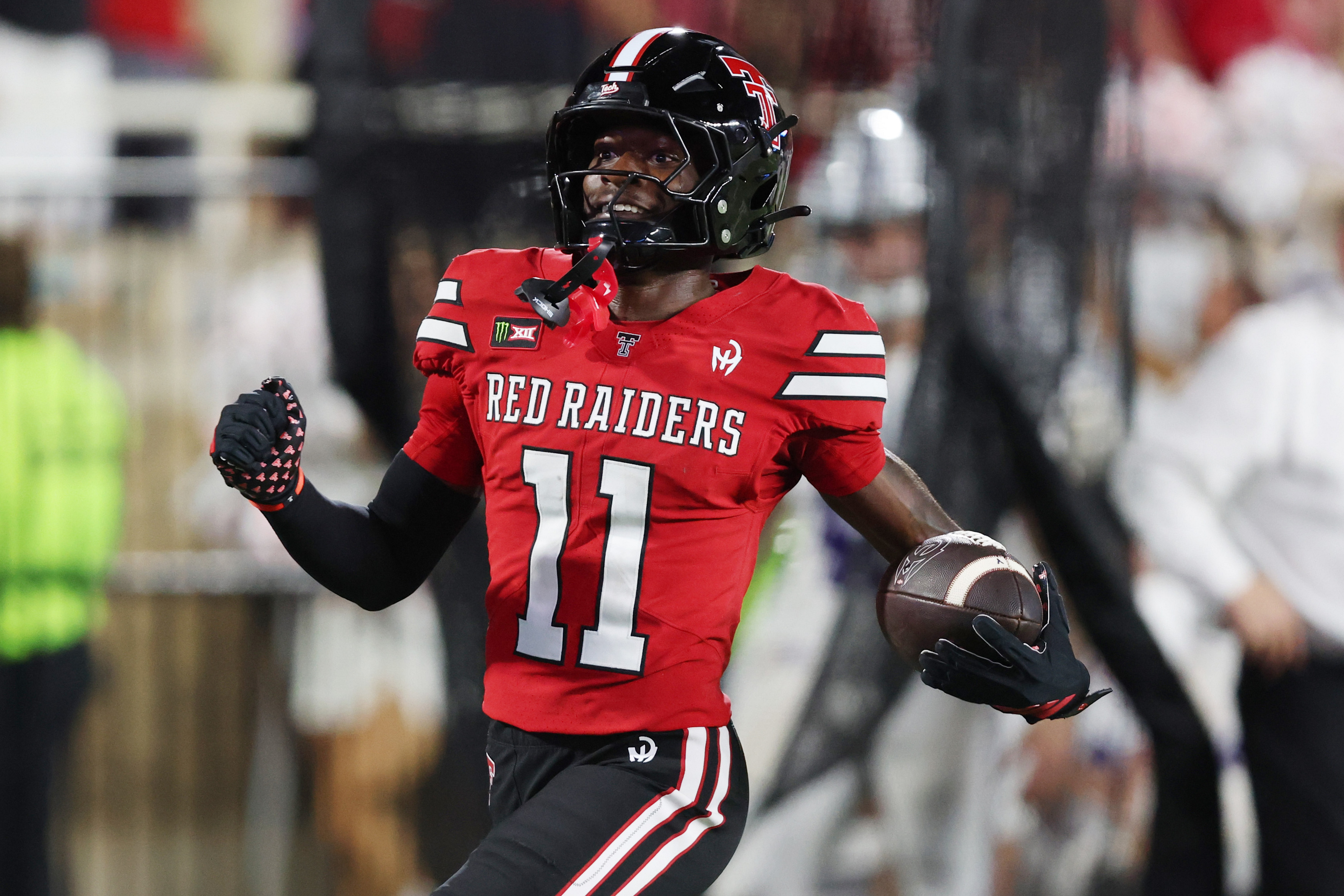 Sep 5, 2026; Lubbock, Texas, USA; Texas Tech Red Raiders wide receiver Malcolm Simmons (11) reacts after scoring a touchdown against the Abilene Christian Wildcats in the second half at Galaxy Stadium. Mandatory Credit: Michael C. Johnson-Imagn Images