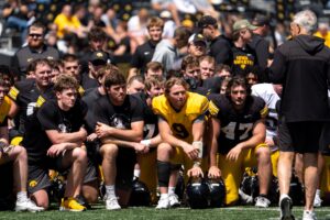Iowa football players listen to head coach Kirk Ferentz speak April 25, 2026 after the team’s spring practice at Kinnick Stadium